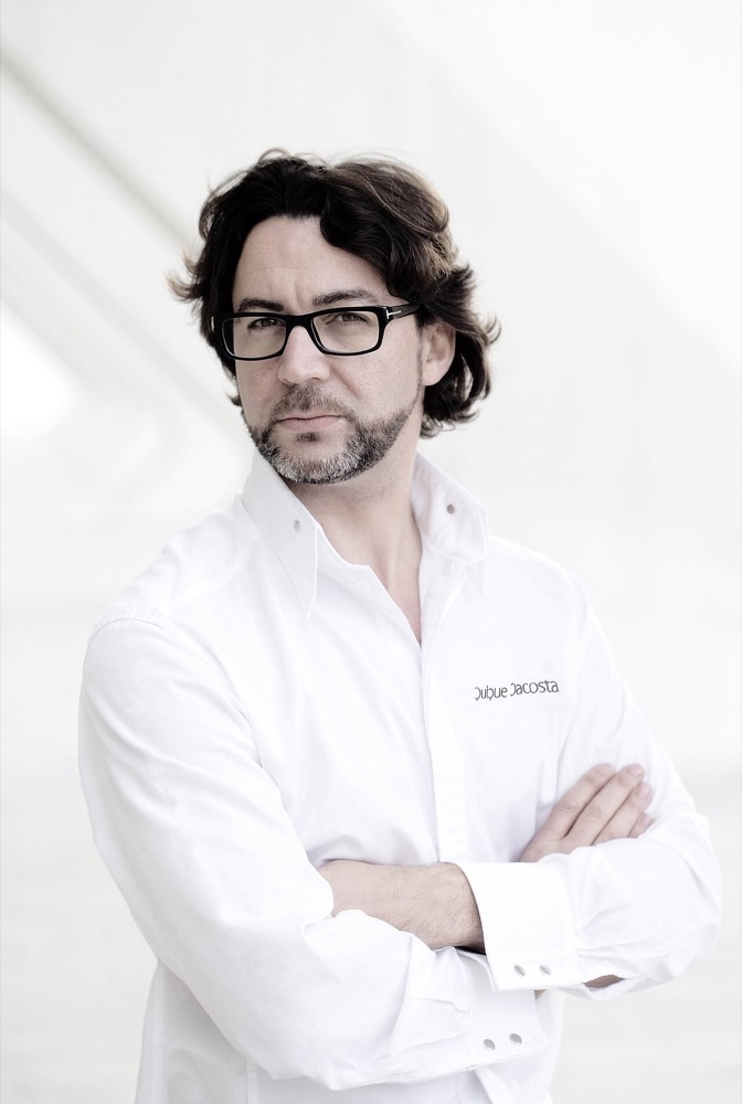 Quique Dacosta in a white shirt with arms crossed
