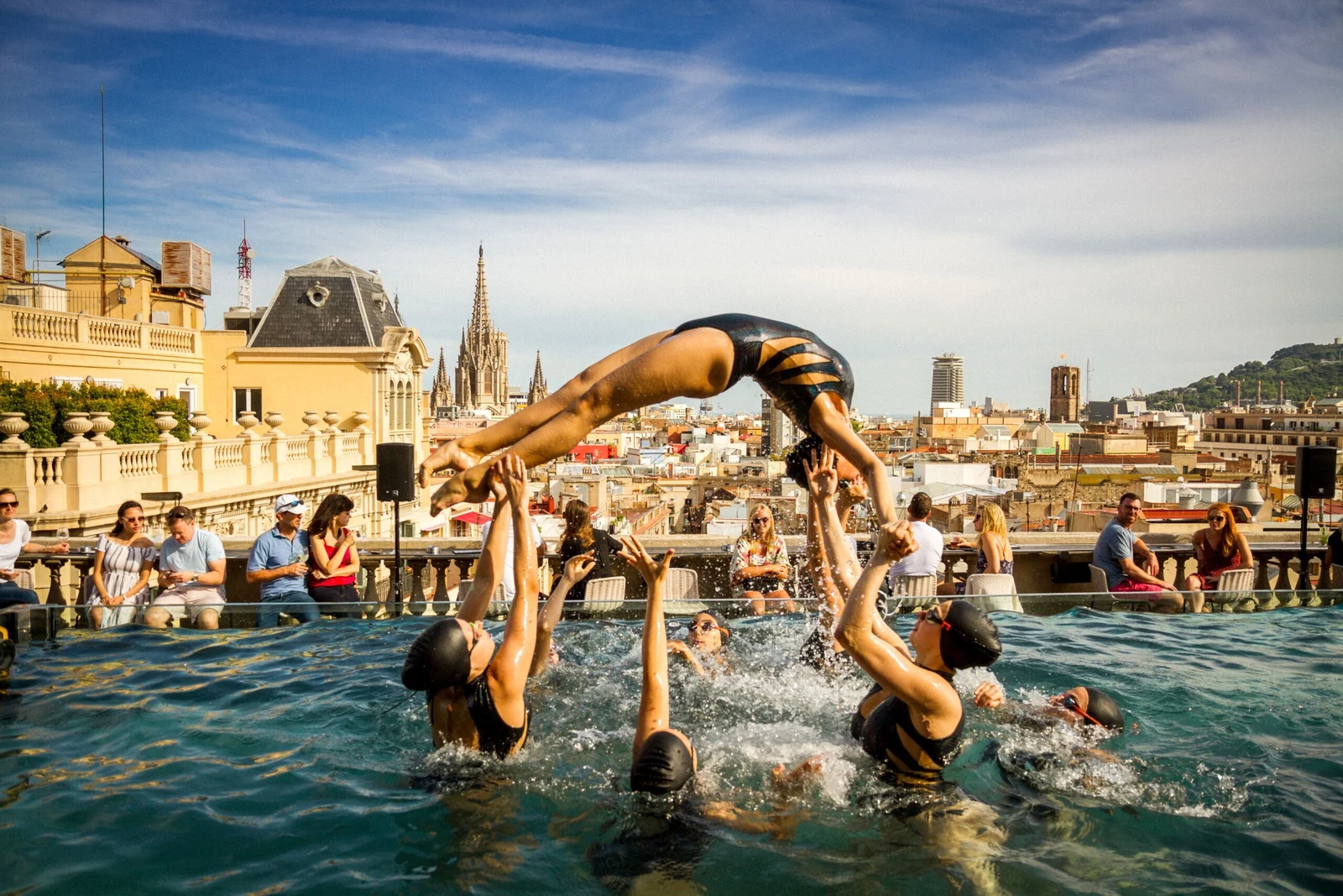 Synchronized swimmers in the rooftop pool at Ohla Barcelona during Hotel Terrace Week