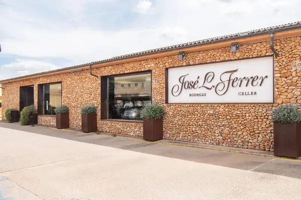 The stone frontage of Bodegas José L. Ferrer in Binissalem