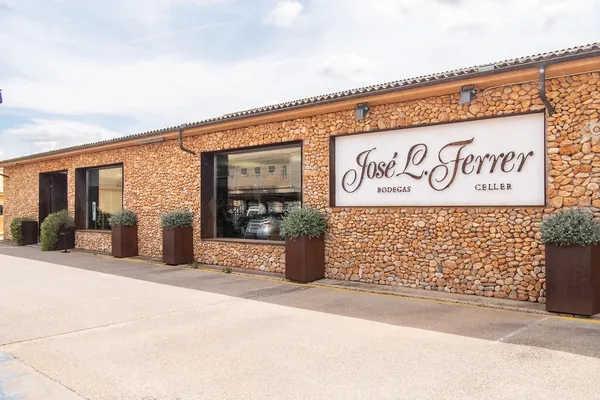The stone frontage of Bodegas José L. Ferrer in Binissalem