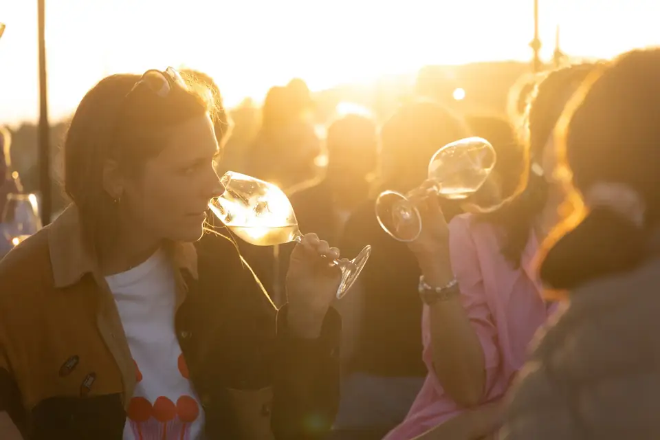 Attendees sipping cava at golden hour during Cavatast in Sant Sadurní d'Anoia