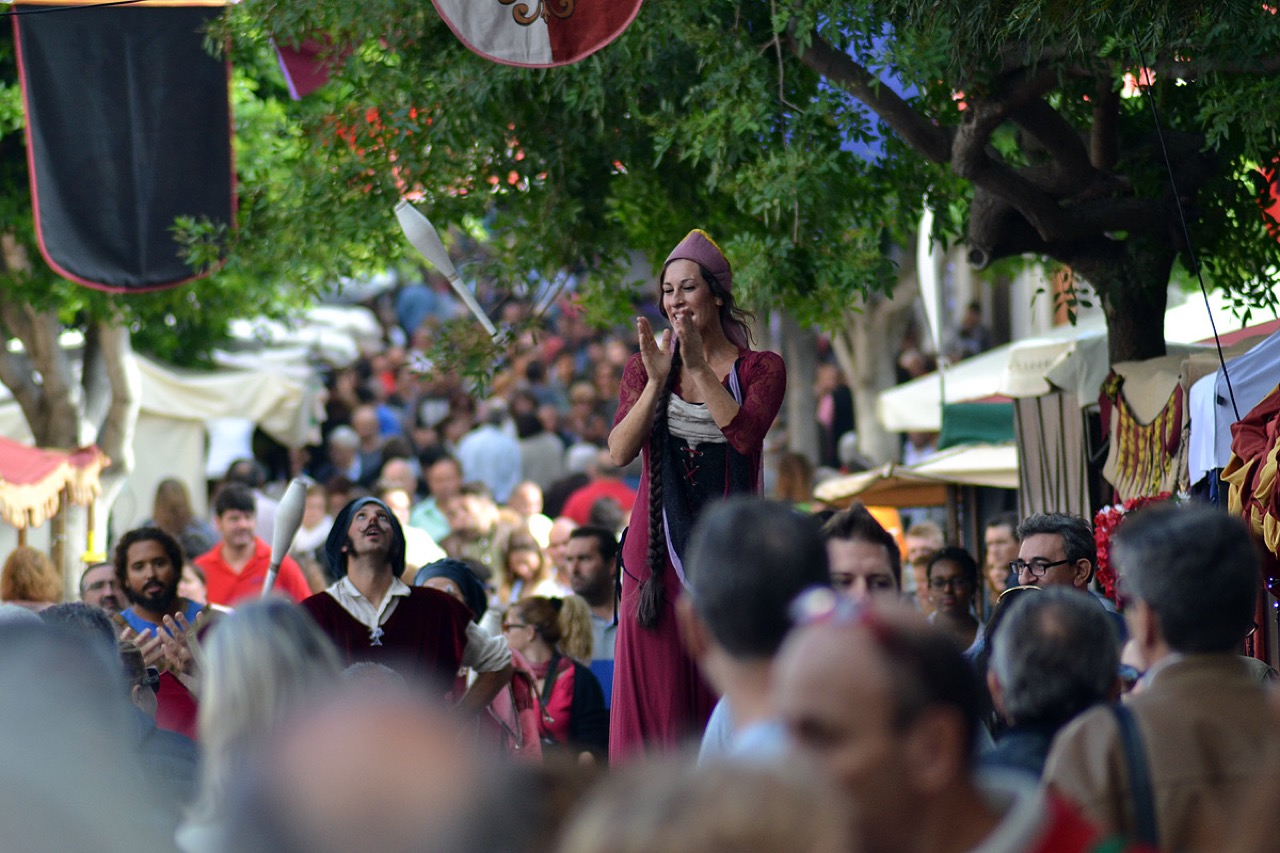 Crowds and costumed performers at the Dijous Bo fair in Inca, Mallorca
