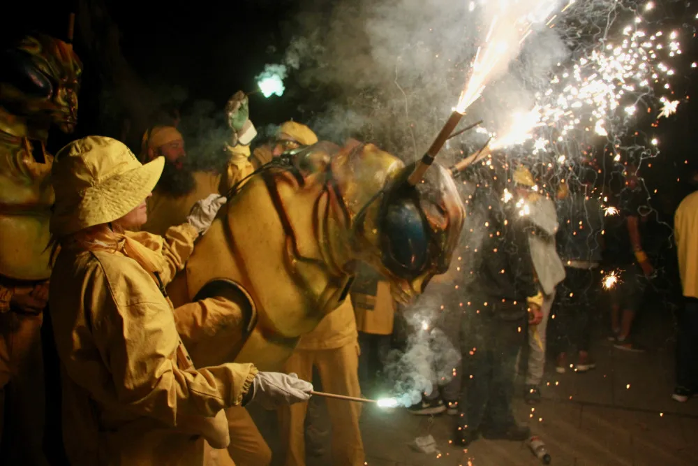 Costumed participants with sparklers during a past Festa de la Fil·loxera