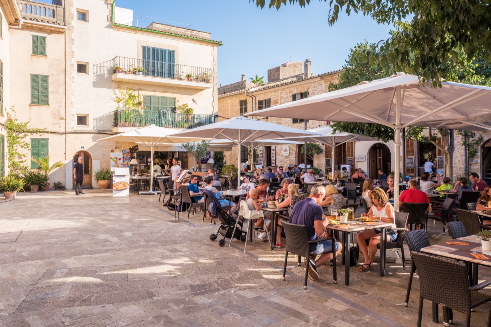 Café terraces in the old town of Alcúdia, Mallorca