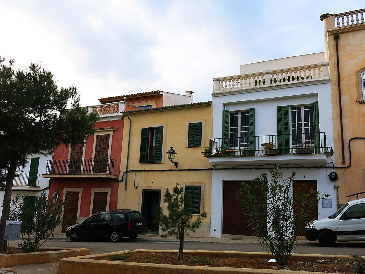 Colorful traditional facades on Placa de Sant Jaume in Portocolom