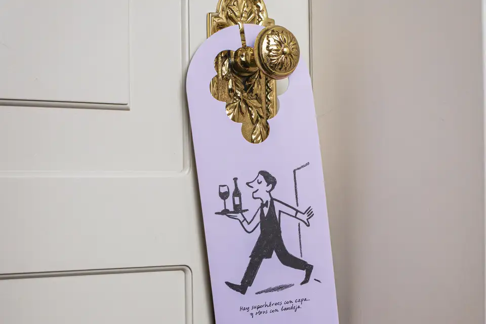 A Hotel Wine Fest door hanger on a hotel room door