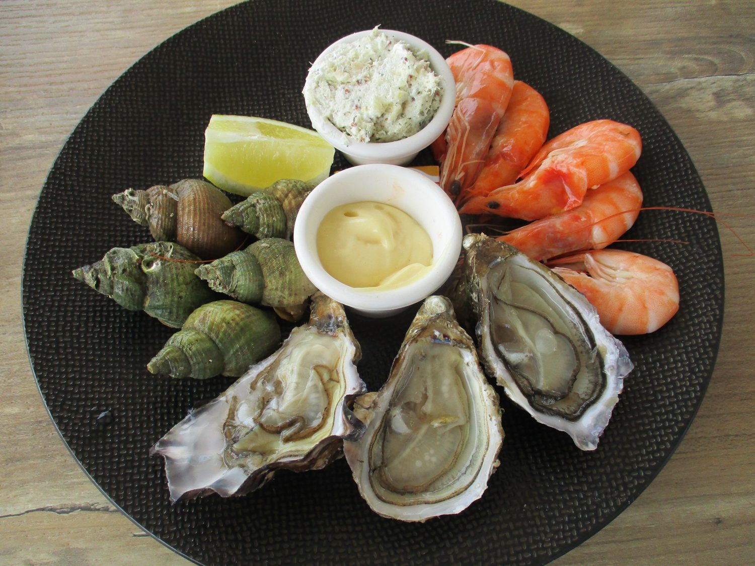 A platter of shellfish — oysters, prawns, whelks and langoustines