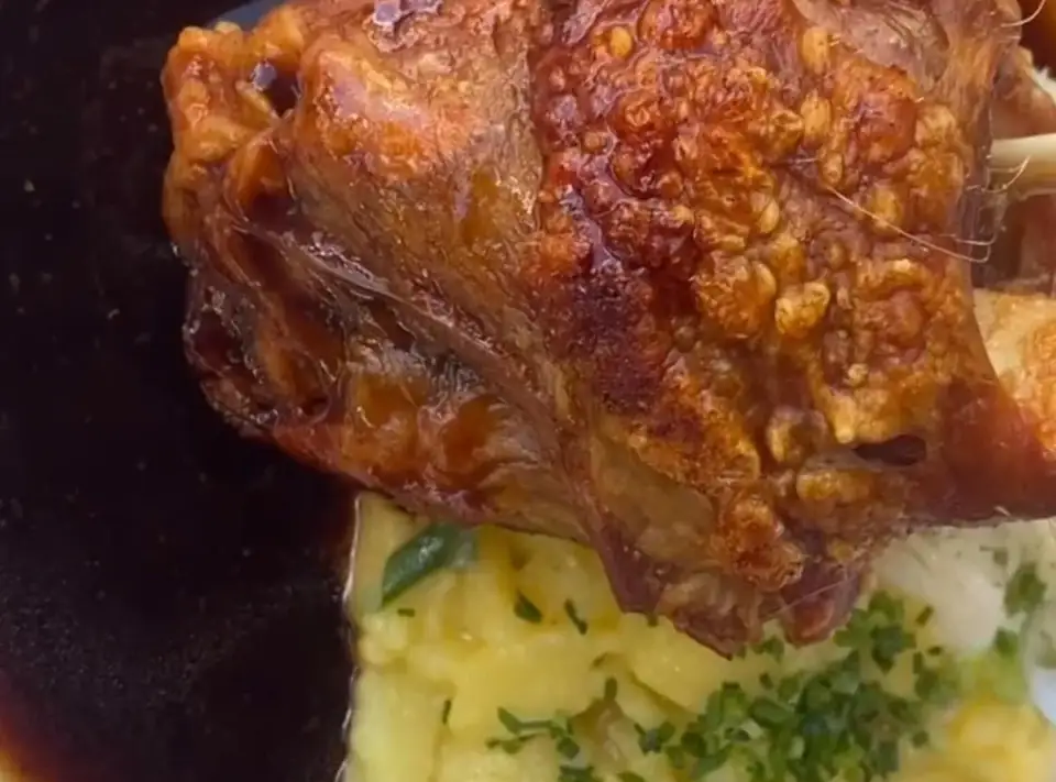 Schweinshaxe, roast pork knuckle with gravy and potato salad, from the Oktoberfest Santa Ponsa menu