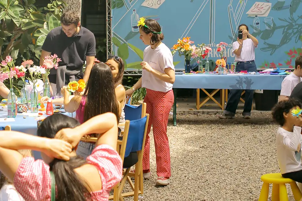 Visitors at a flower-arranging workshop in the garden at Palo Market Fest