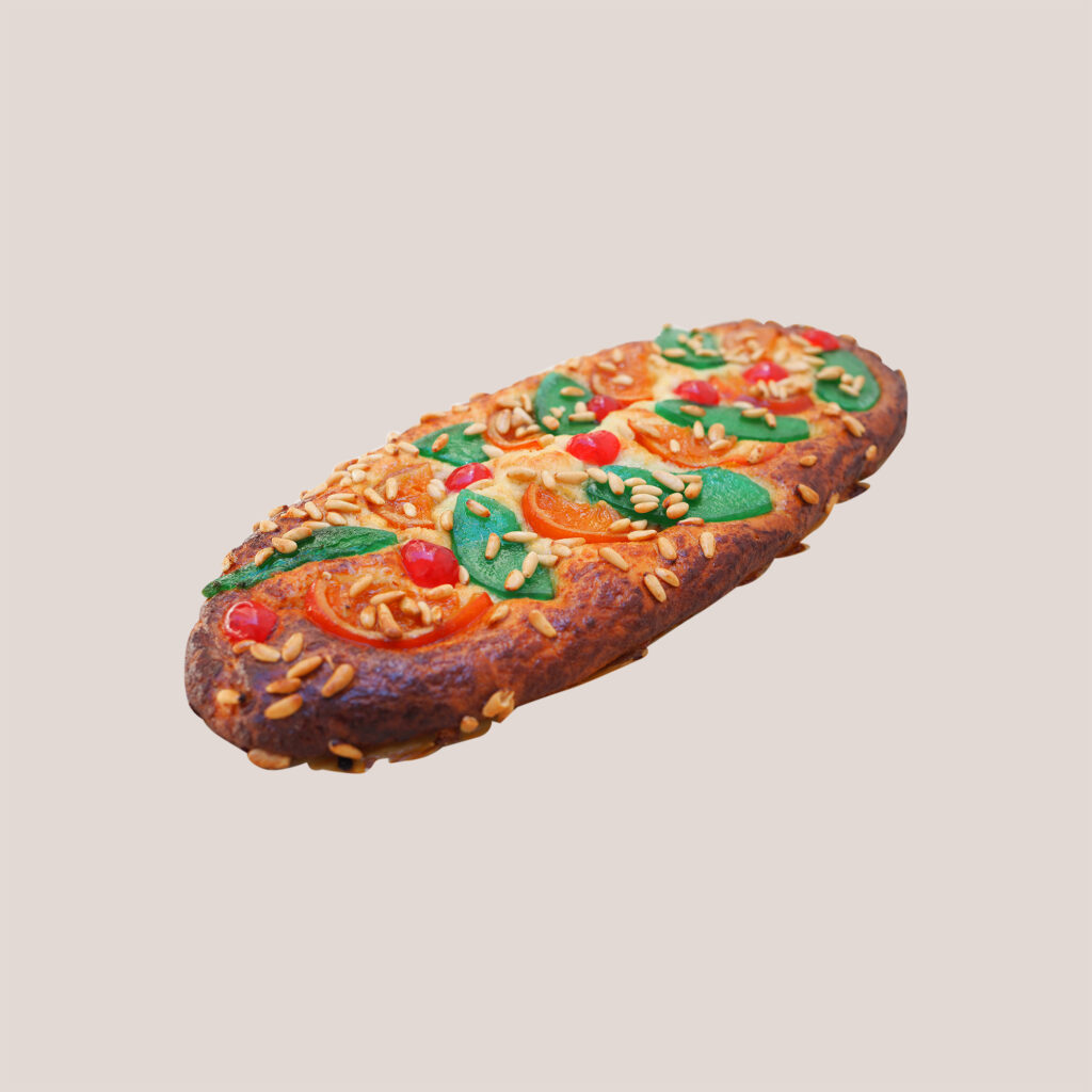 Coca de Sant Joan, the traditional Catalan flatbread with candied fruit and pine nuts eaten on the night of Sant Joan