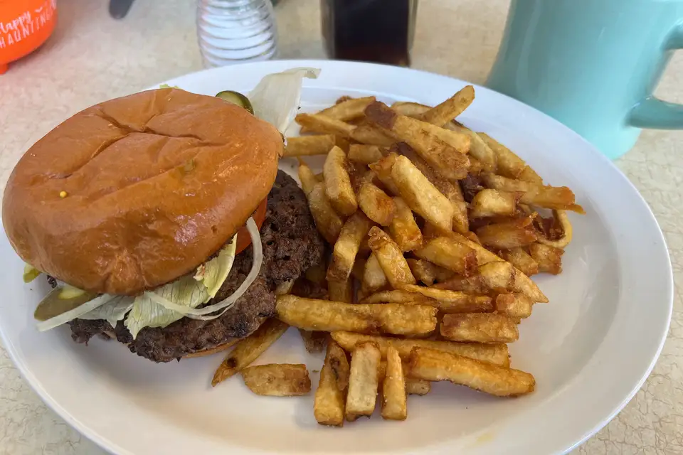 A double smash burger with fries