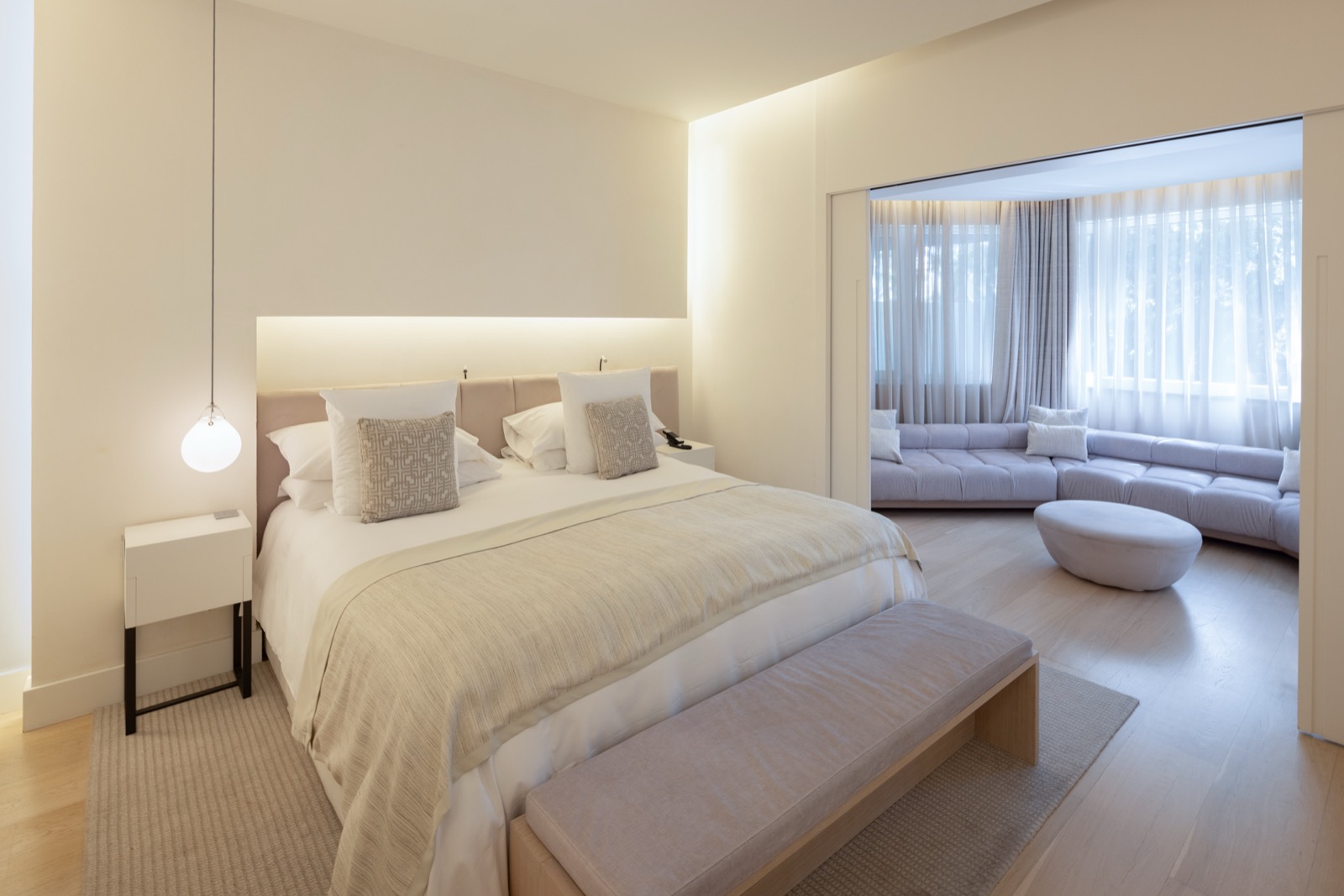 ABaC suite bedroom with a separate lounge nook behind sliding doors