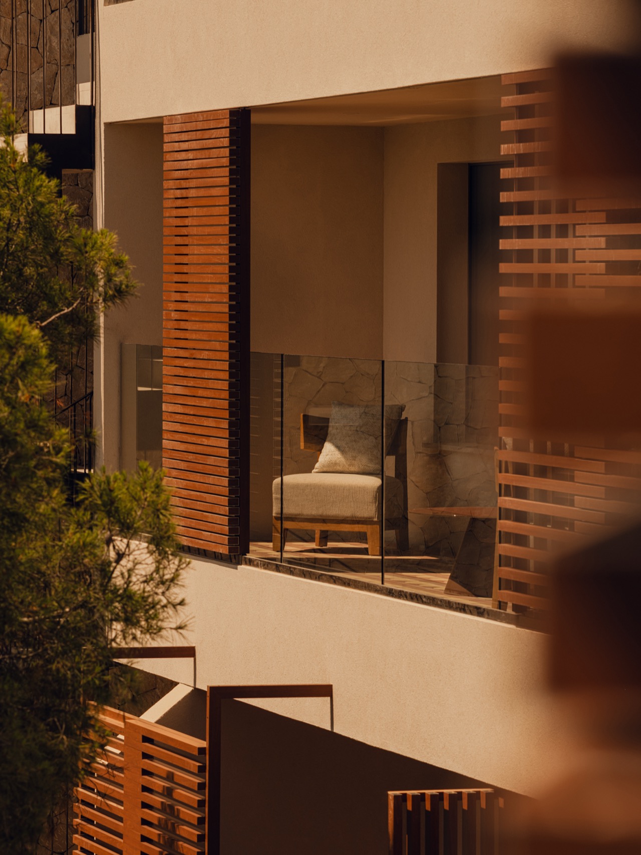 Exterior architectural detail of a private terrace at Aethos Mallorca with wood slat screens