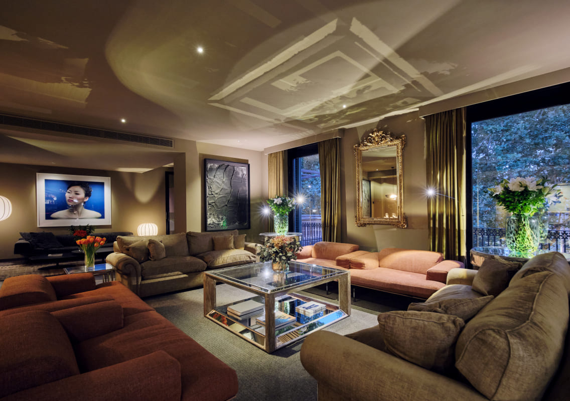 Lounge seating area at Can Alomar with art on the walls