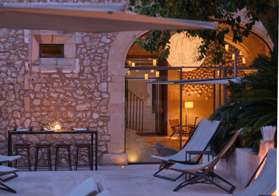 Courtyard terrace at Can Auli Luxury Retreat in the evening