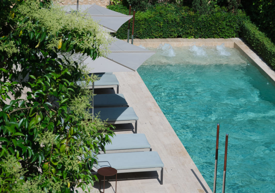 Aerial view of the pool and sun loungers at Can Auli Luxury Retreat