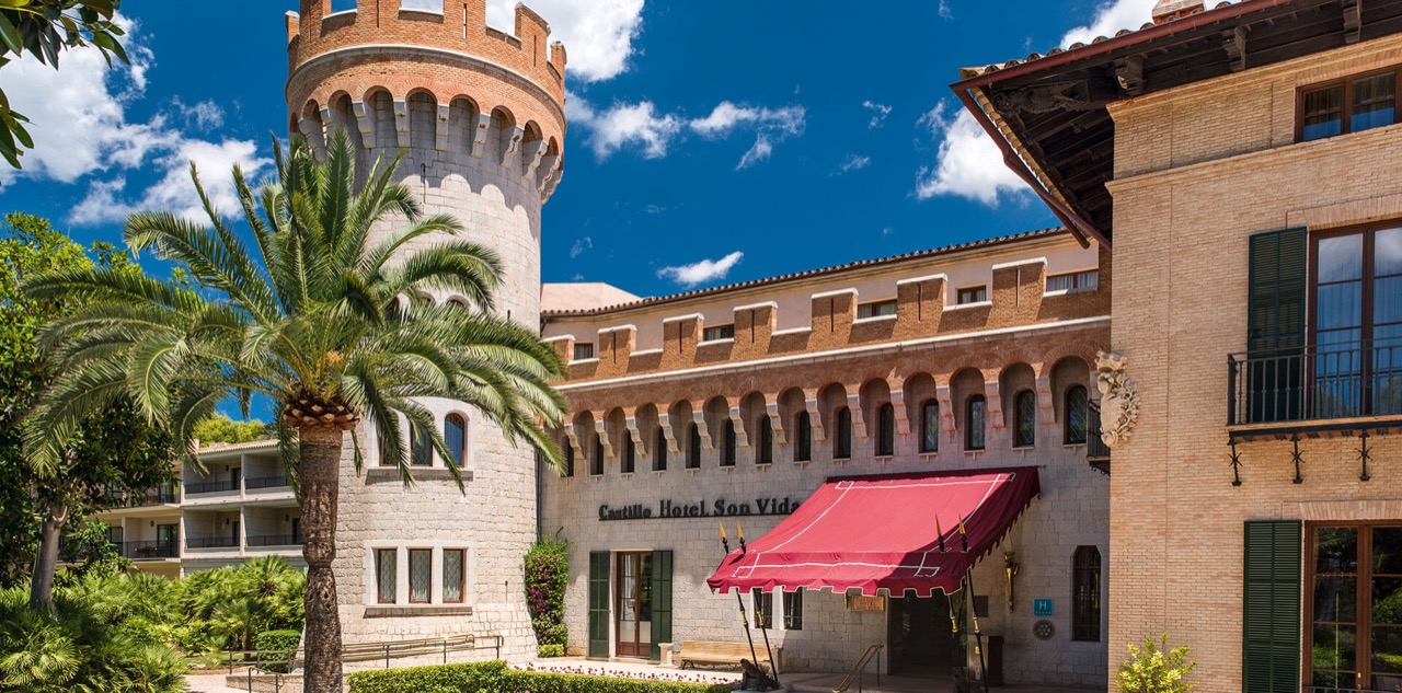 Castillo Hotel Son Vida exterior with its castle tower and palm trees