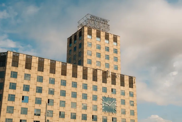Catalonia Barcelona Plaza tower facade with rooftop signage