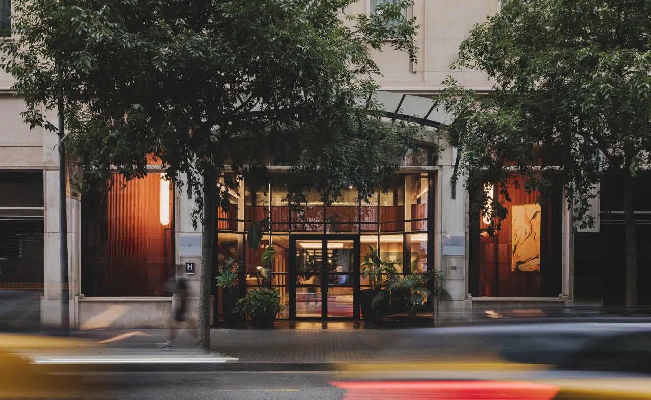 Street-level hotel entrance facade at dusk