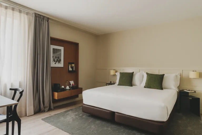 Superior room with a king bed and a desk area