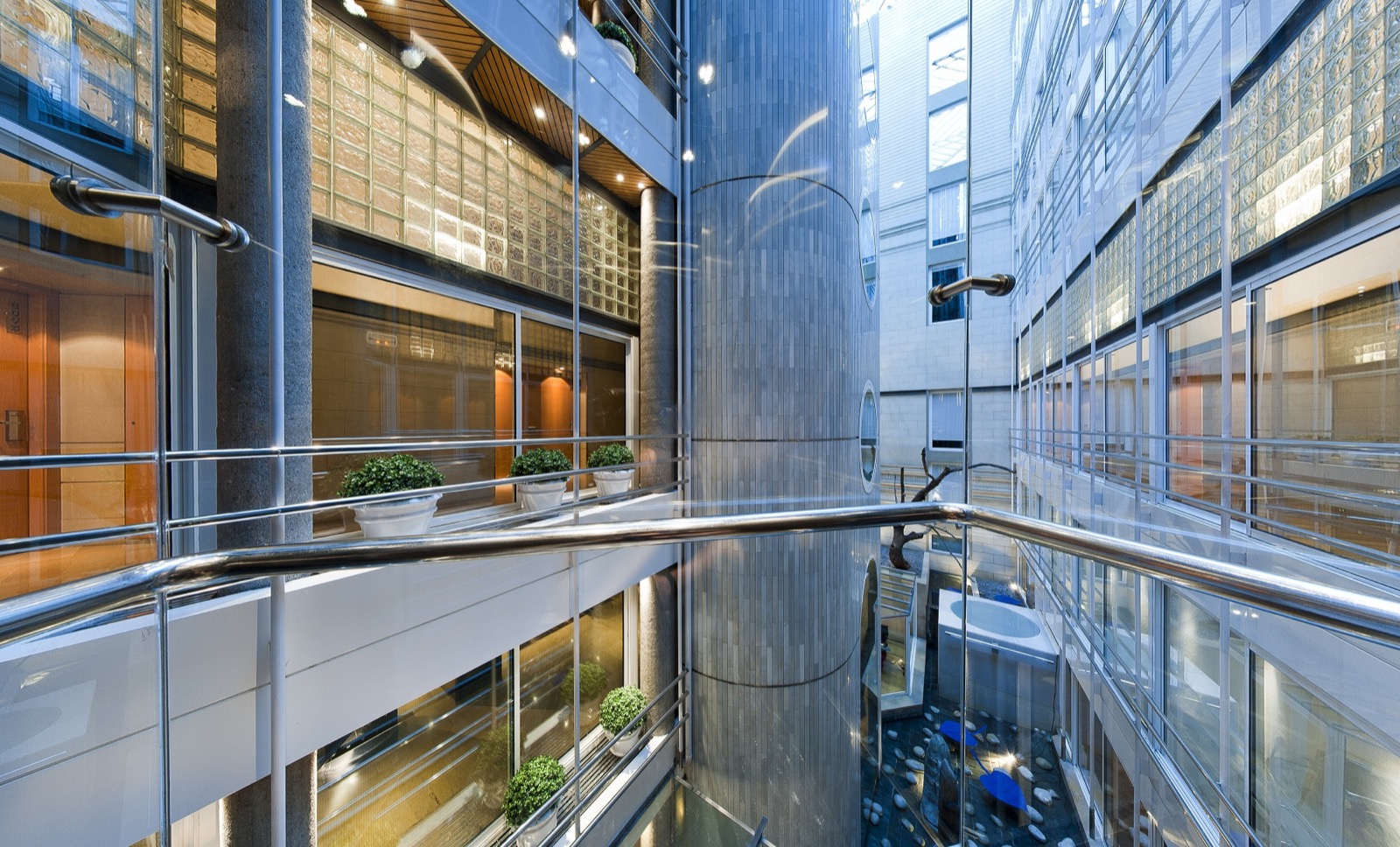 Hotel Claris glass-and-steel interior atrium architecture