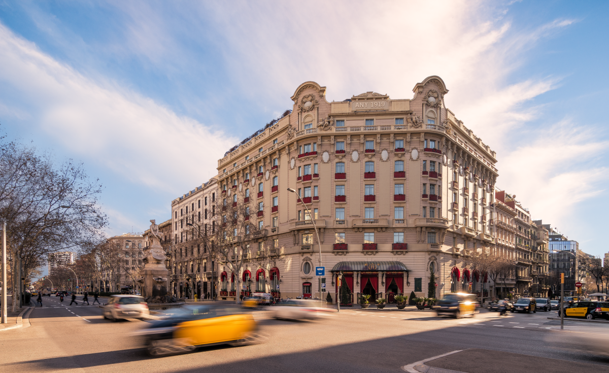 Hotel El Palace Barcelona facade on Gran Via with street traffic in the foreground