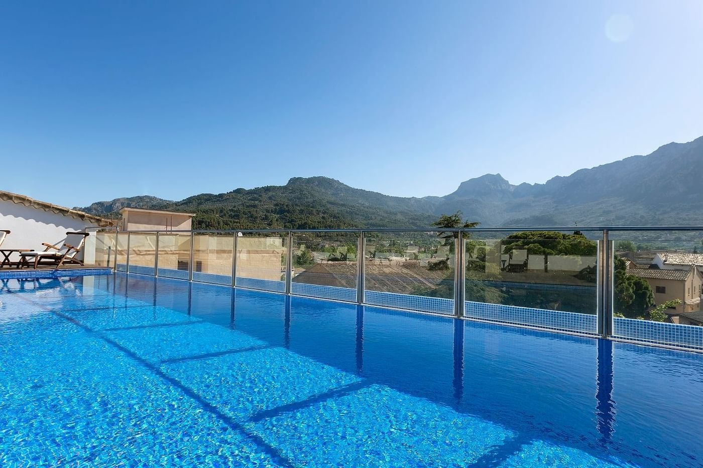Glass edged rooftop pool with a view of the Tramuntana mountains