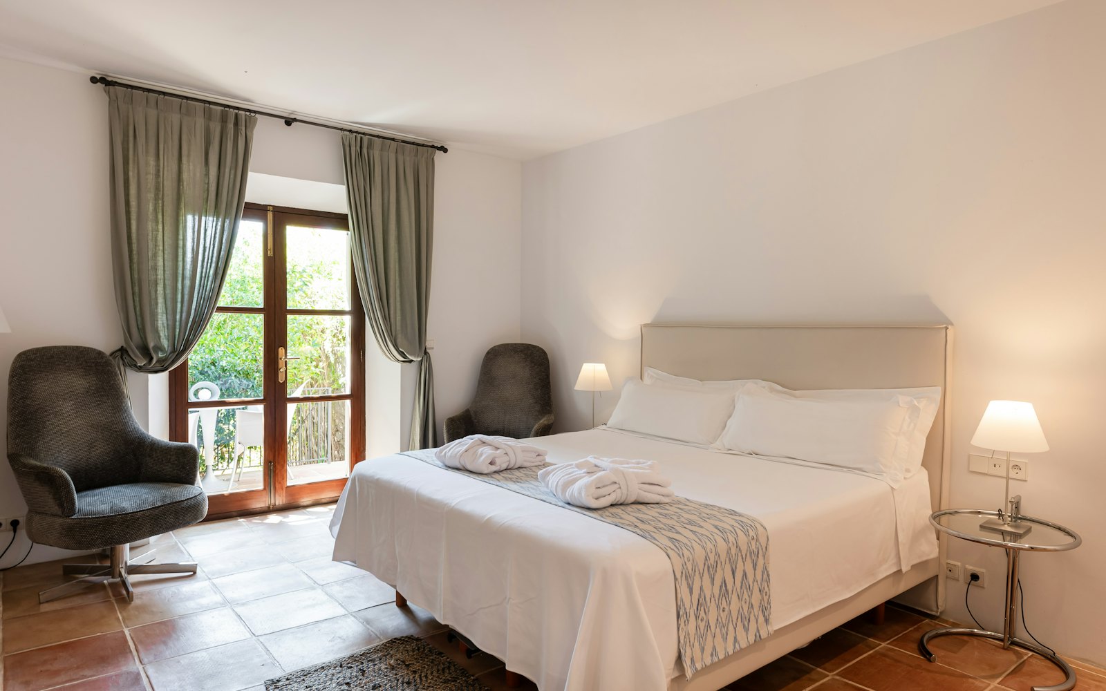 Double room with French doors open to a small balcony over the garden