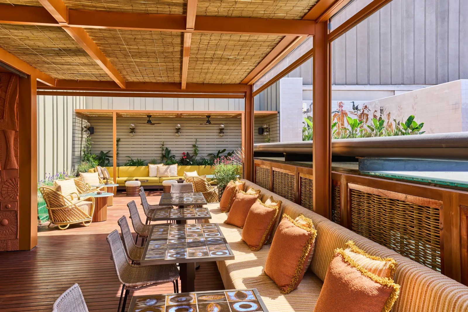 Rooftop terrace bar with a pool edge and a city view