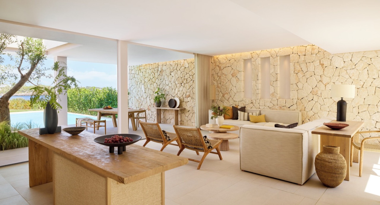 Bungalow suite living and dining area opening to a private pool