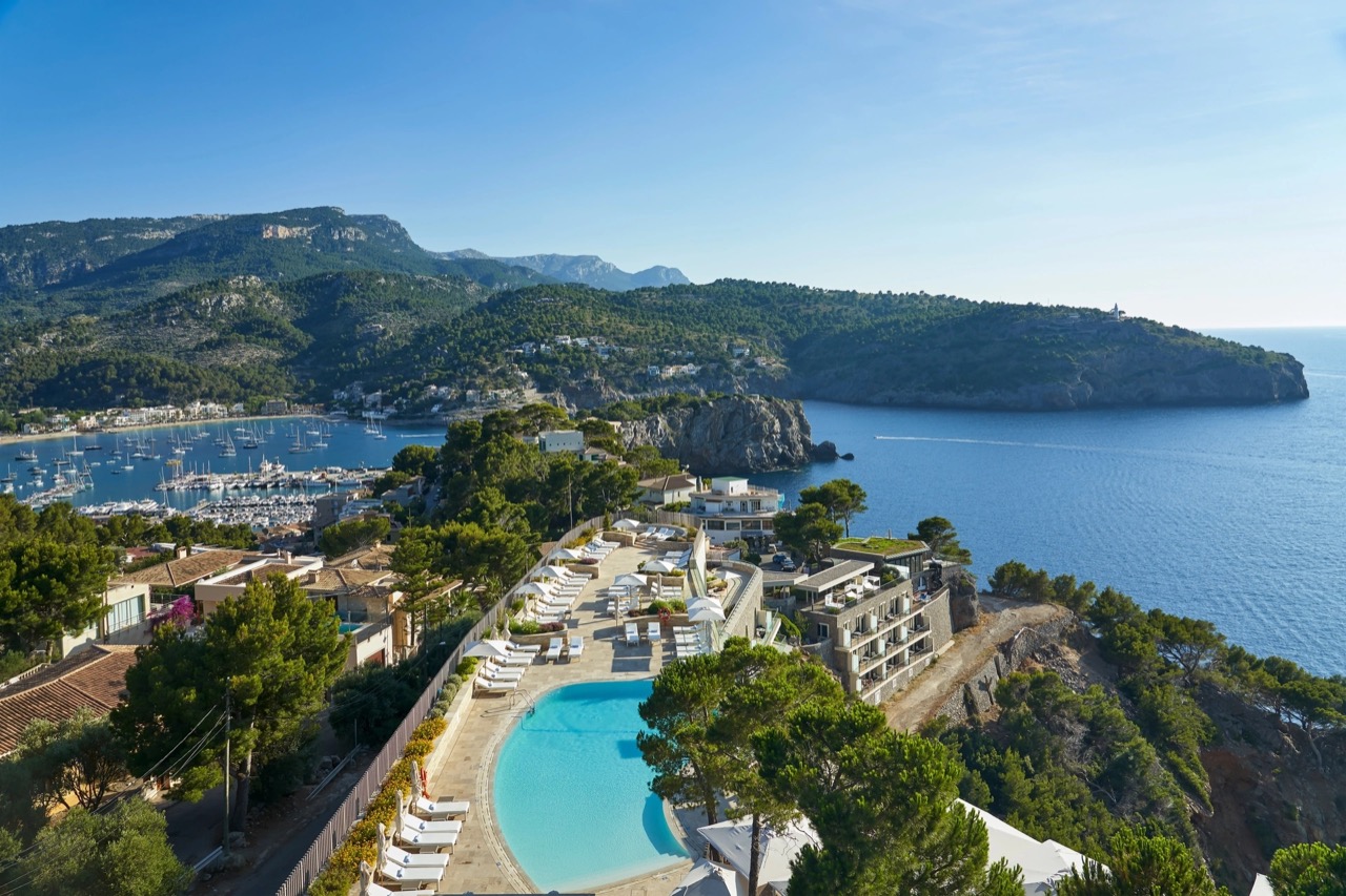Aerial view of the clifftop hotel and pool overlooking Port de Soller bay