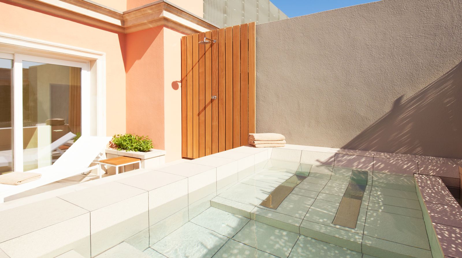 Private rooftop plunge pool and outdoor shower on a suite terrace