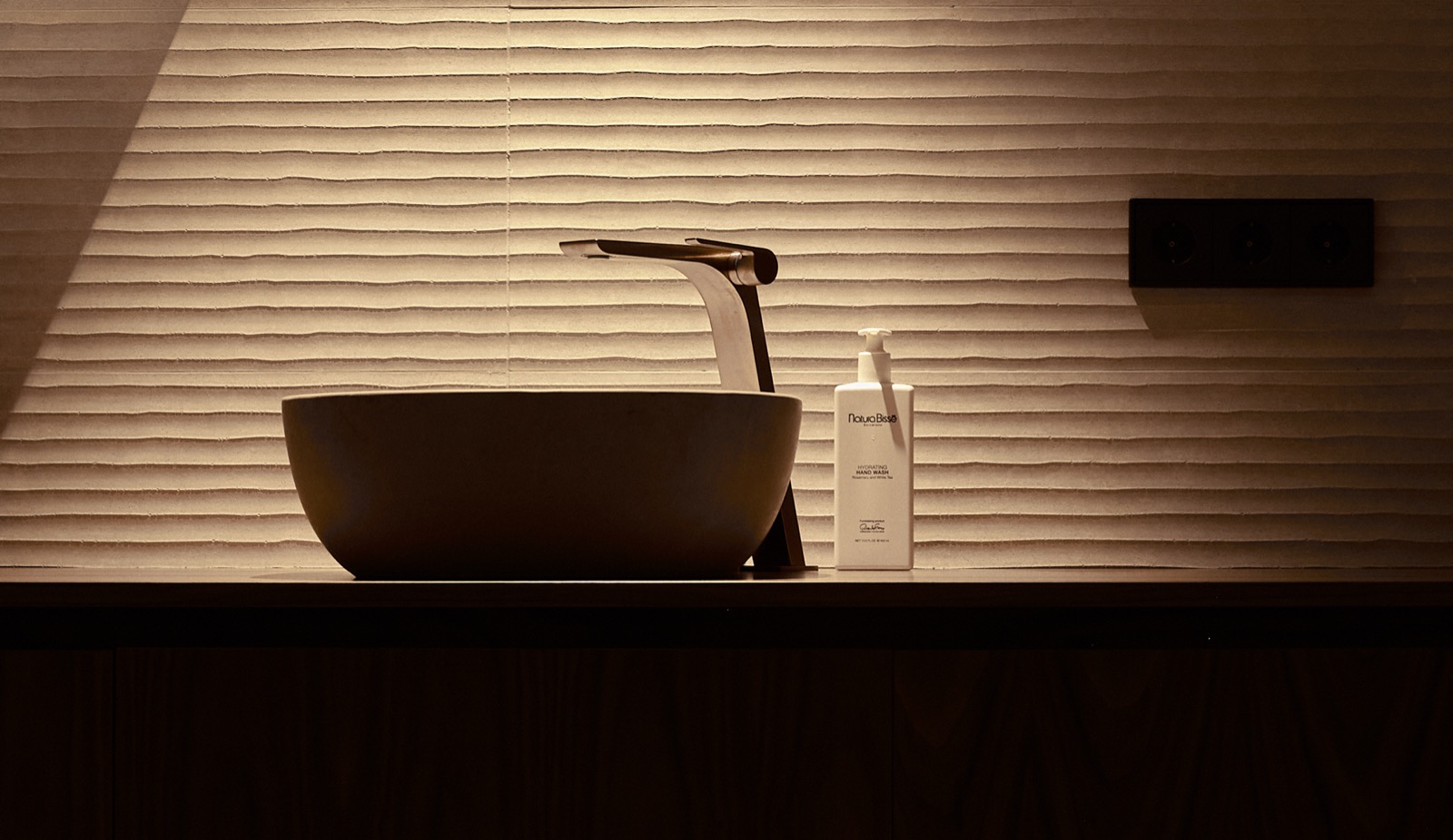 Suite bathroom with a dark-wood vanity