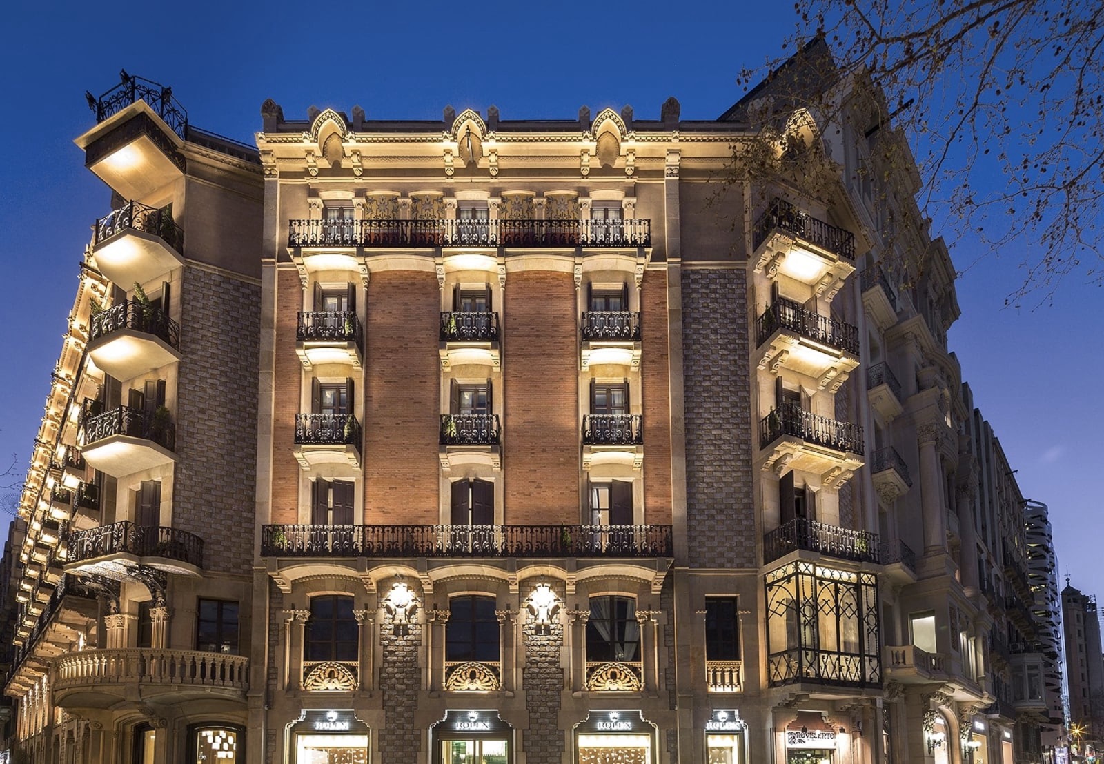 Monument Hotel's illuminated Passeig de Gràcia facade at dusk