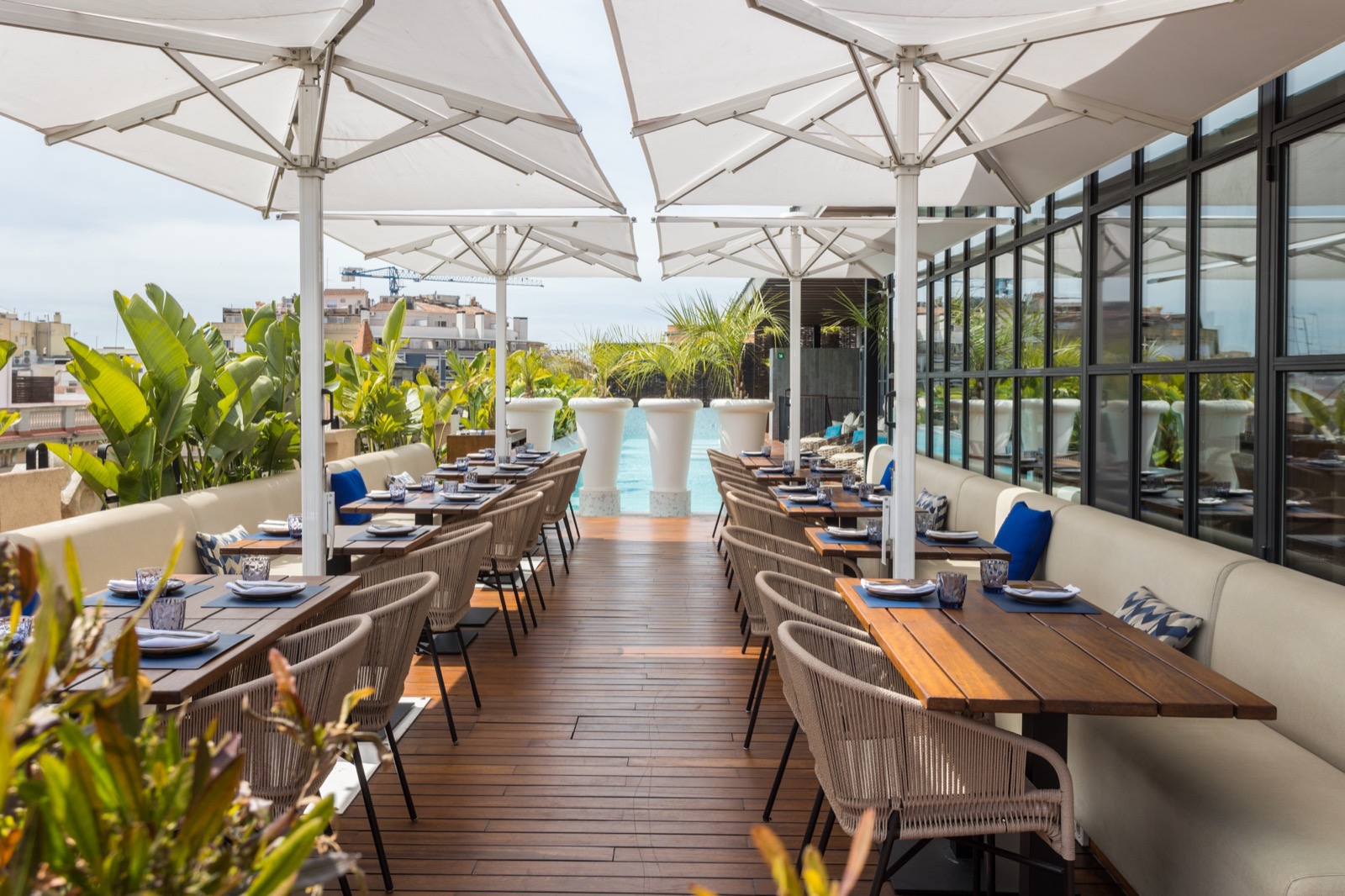 Monument Hotel rooftop terrace dining area with a city view