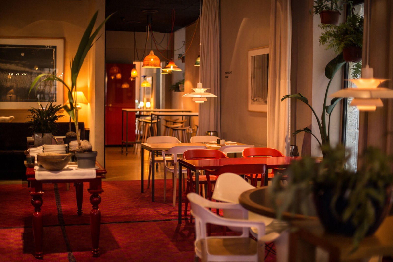 Hotel Neri restaurant dining room with woven pendant lamps