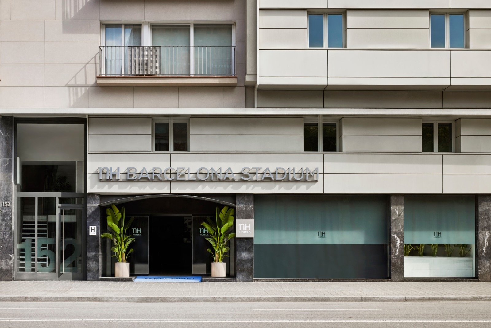 NH Barcelona Stadium street-level building facade and entrance