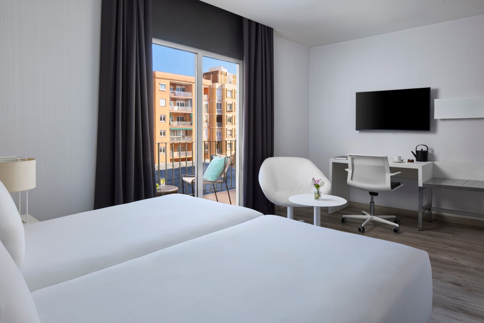 Superior room with a balcony view over the neighbourhood rooftops