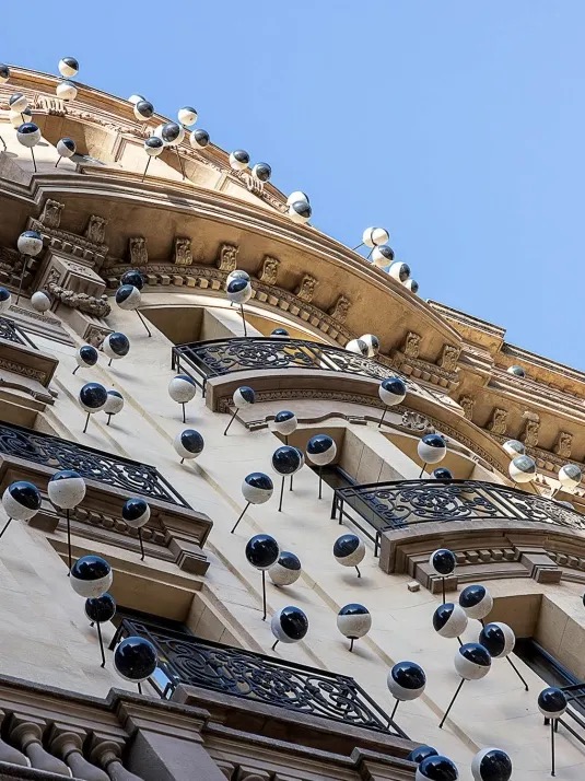 Gothic Quarter facade with the white sphere art installation across the balconies