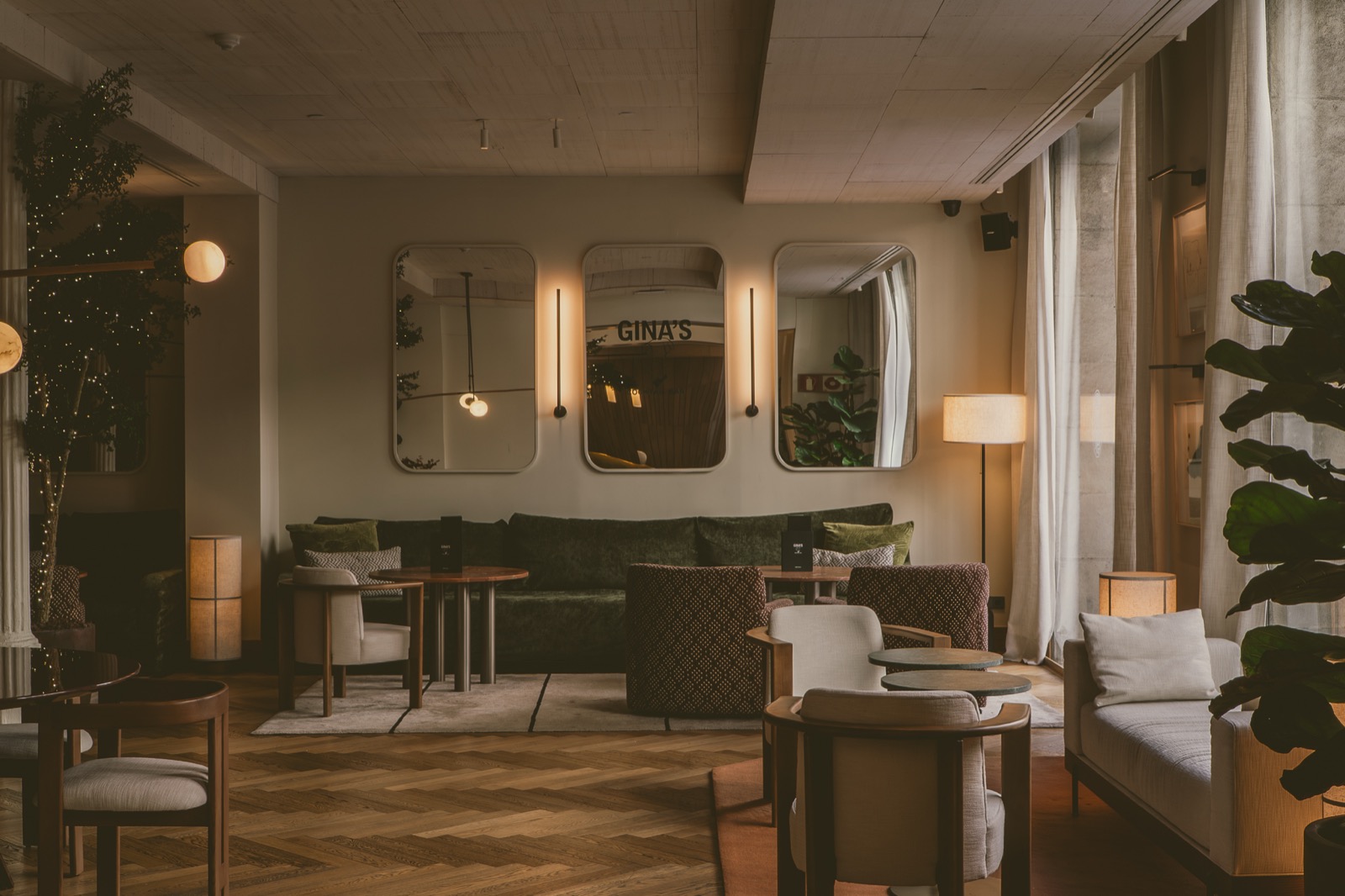Gina's lounge and bar seating area with a mirrored wall