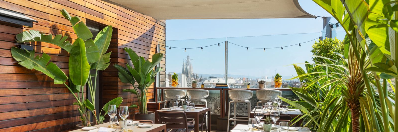 Rooftop restaurant terrace with the Sagrada Família in the distance