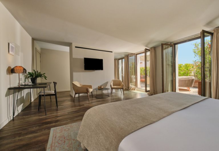 Suite bedroom at Sant Jaume Design Hotel with terrace access