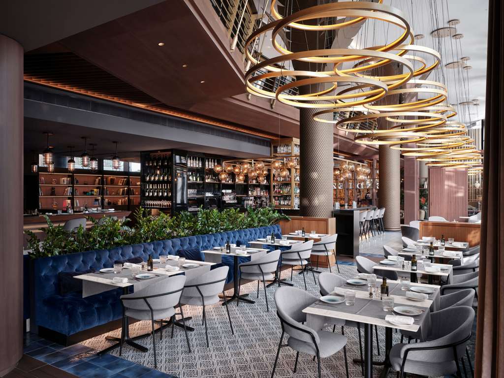 TENDIEZ restaurant and bar with circular pendant lighting