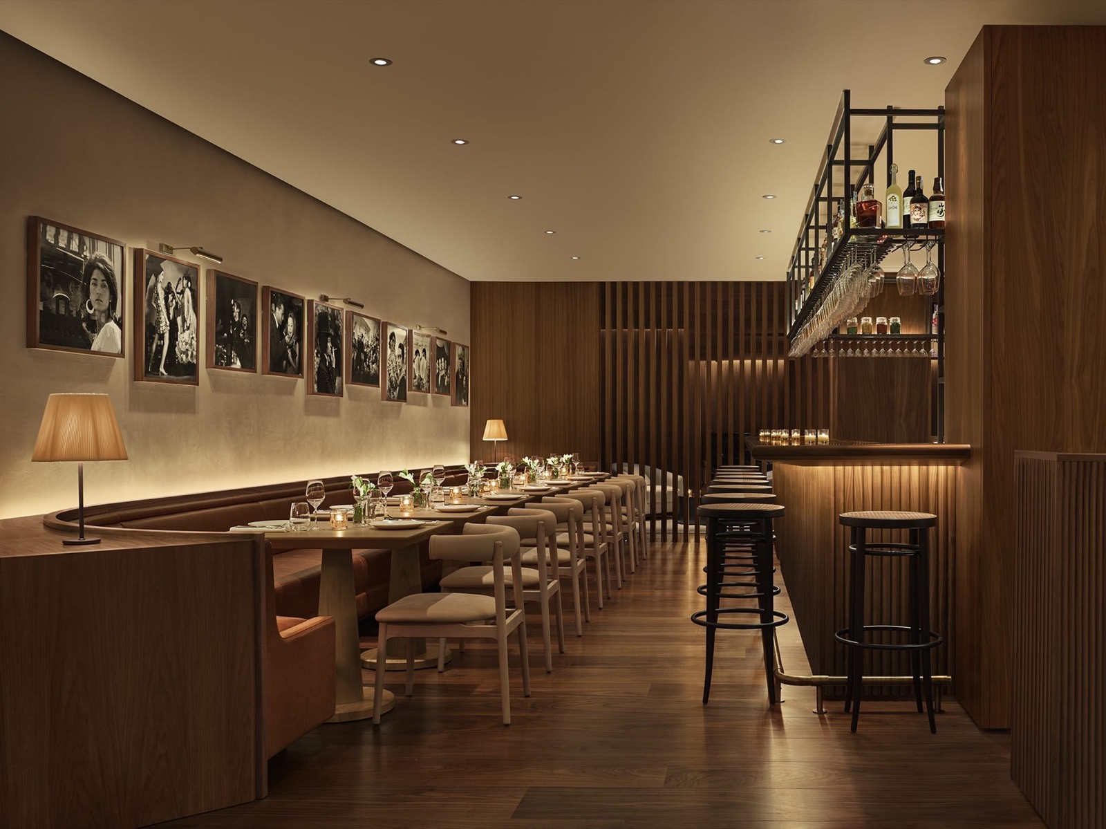 Bar Veraz dining room with banquette seating and framed photography