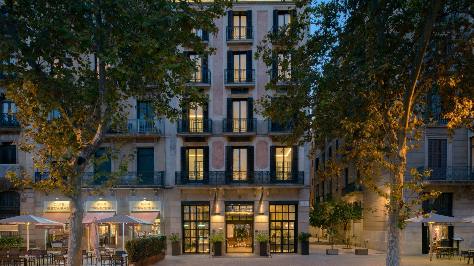The Serras Barcelona facade at twilight in the Gothic Quarter