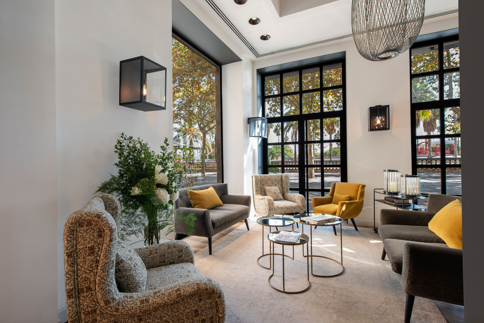 The Serras lobby lounge with floor-to-ceiling black-framed windows