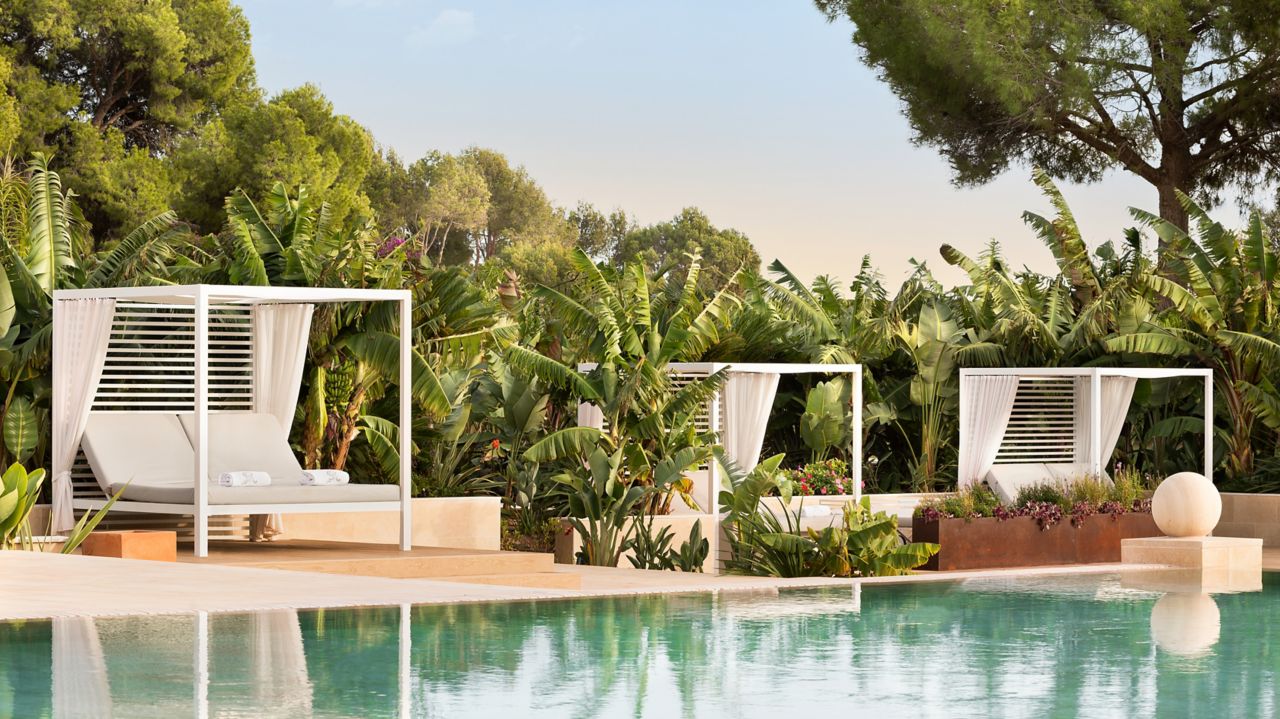Poolside daybed cabanas at The St. Regis Mardavall Mallorca Resort