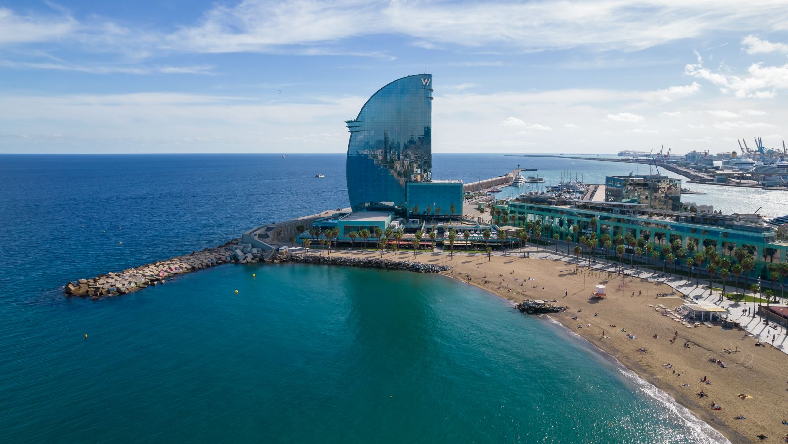 Aerial view of the W Barcelona's sail-shaped glass tower on the Barceloneta waterfront