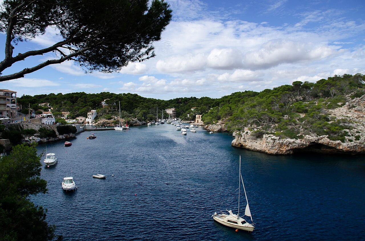 Narrow fjord-like harbour of Cala Figuera lined with boats, Mallorca, Spain