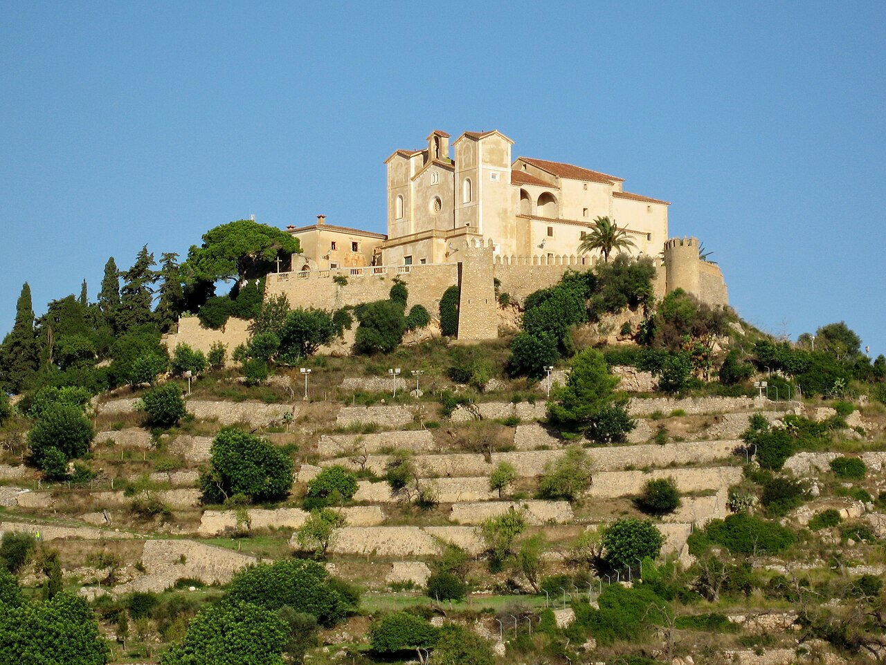 Hilltop sanctuary of Sant Salvador above terraced fields, Artà, Mallorca, Spain